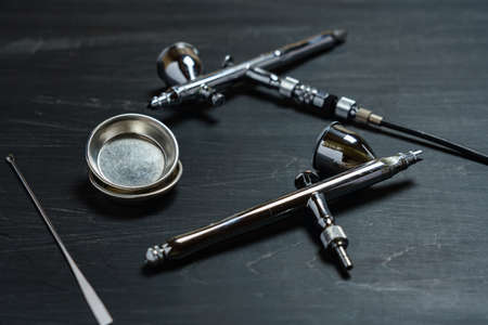 Air brush tool for painting on wooden backgroundの写真素材