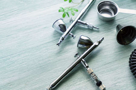 Air brush tool for painting on wooden backgroundの写真素材