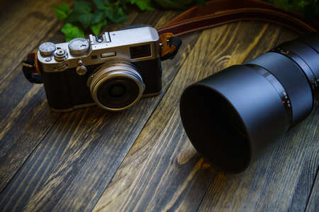 Old style digital cameras isolated on wooden table