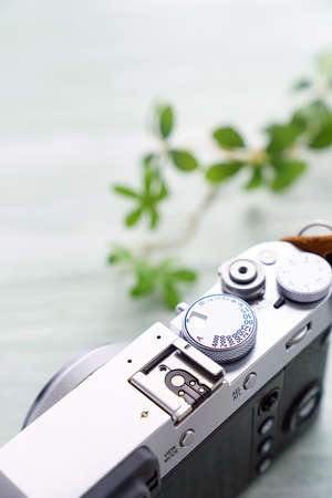 Old style digital cameras isolated on wooden tableの写真素材