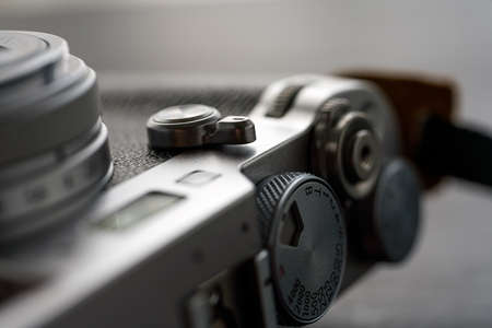 Old style digital cameras isolated on wooden tableの写真素材