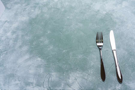 Empty plate, knife and forkの写真素材