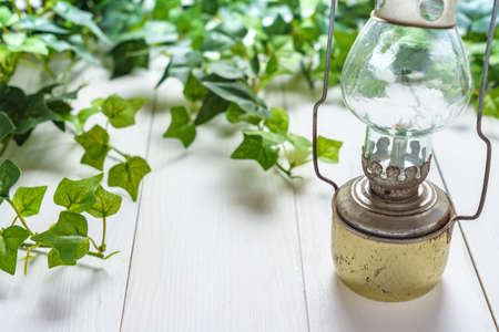 Antique lantern on wooden table