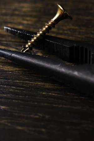 Needle-Nose Pliers on a wooden board