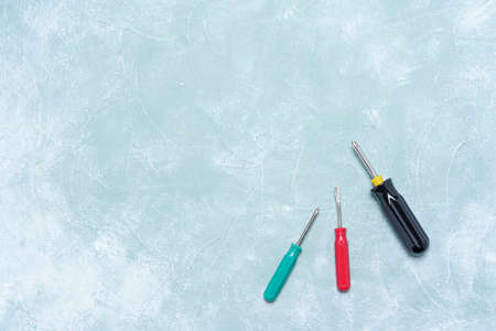 Screwdriver on a wooden board