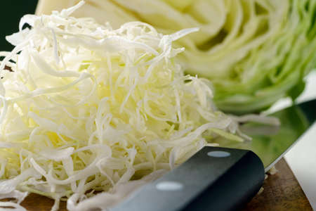 Fresh cabbage on wooden tableの写真素材