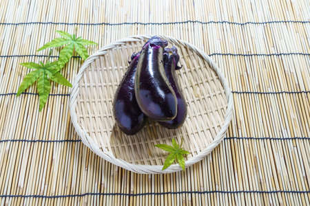 Fresh eggplant on wooden tableの写真素材