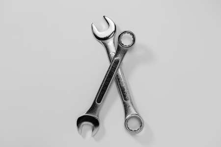 Set of spanners and wrenches on dark background