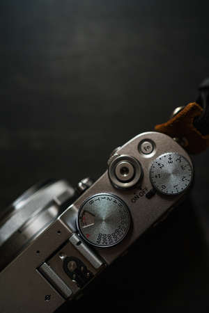 Old style digital cameras isolated on wooden tableの写真素材