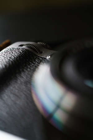 Old style digital cameras isolated on wooden table