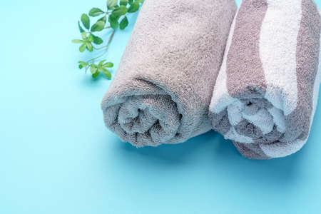 Stack of clean towels on wooden tableの写真素材