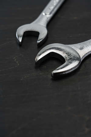 Set of spanners and wrenches on dark backgroundの写真素材