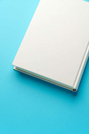 Hardback book on color background