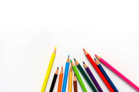Colored pencils on white background