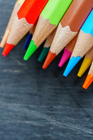 Colored pencils on wooden backgroundの写真素材