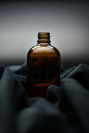 Brown medicine bottle on dark backgroundの写真素材