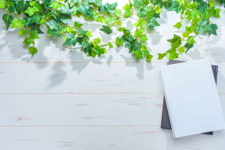 Hardback book on wooden tableの写真素材