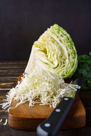 Fresh cabbage on wooden tableの写真素材
