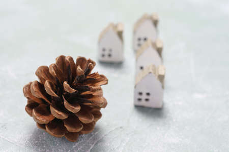 Miniature house on wooden board