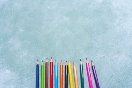 Colored pencils on wooden boardの写真素材