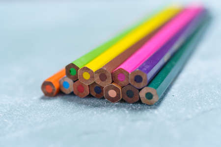 Colored pencils on wooden boardの写真素材