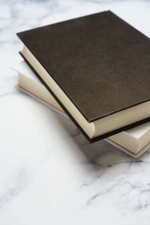 Hardback book on marble  background