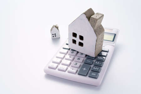 Calculator and miniature houseの写真素材