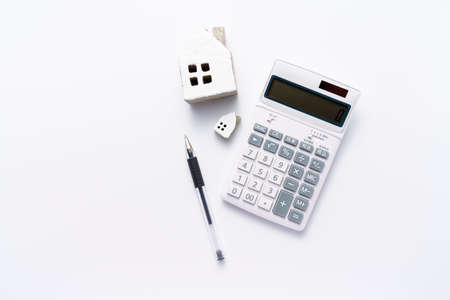 Calculator and miniature houseの写真素材
