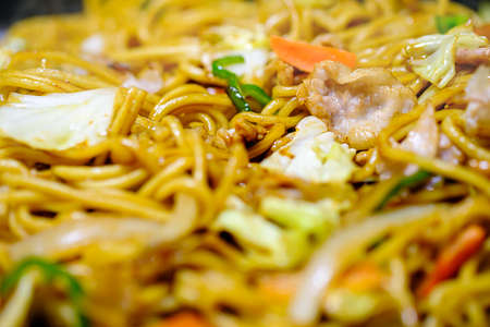 Japanese fried noodles 'Yakisoba' (Yakisoba are stir fried noodles with pork or seafood, vegetables, and a sweet and salty sauce)の写真素材