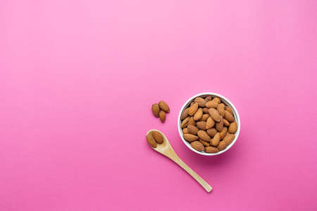 Almonds nuts shot on a color backgroundの写真素材