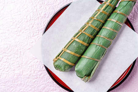 Japanese rice cake "Chimaki" on color backgroundの写真素材