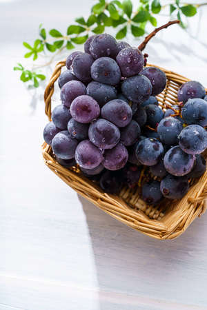 Fresh grapes on wooden table