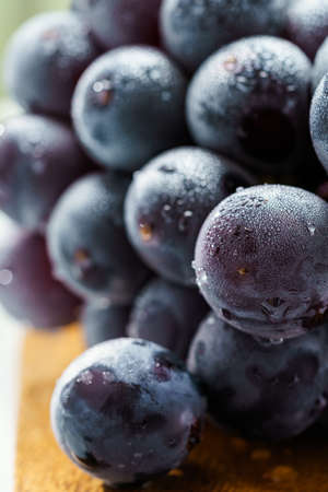 Fresh grapes on wooden table