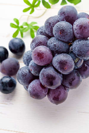 Fresh grapes on wooden table