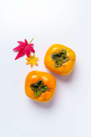 Fresh ripe persimmons on white backgroundの写真素材