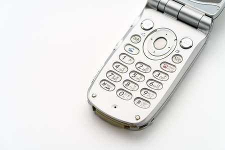 Flip cell mobile cell phone on white backgroundの写真素材