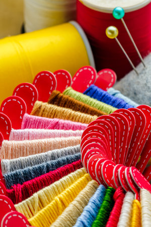 Close up sewing accessories on light backgroundの写真素材