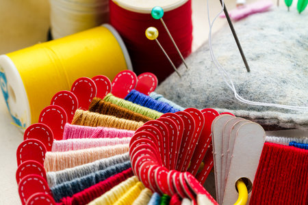 Close up sewing accessories on light backgroundの写真素材