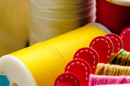 Close up sewing accessories on light backgroundの写真素材