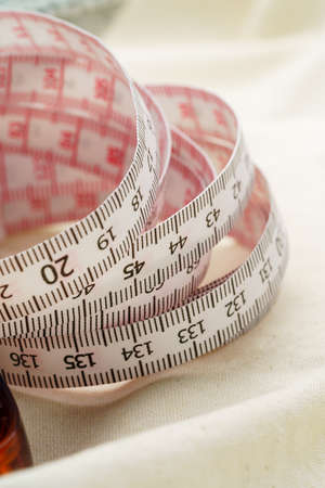 White measuring tape on wooden table