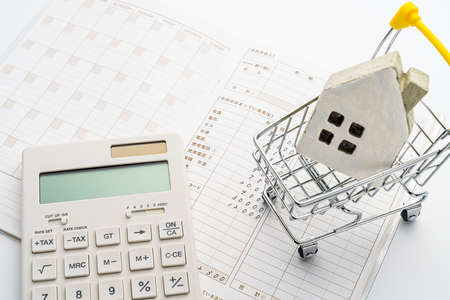 Household accounts book and saving money. Calculating personal finance.の写真素材