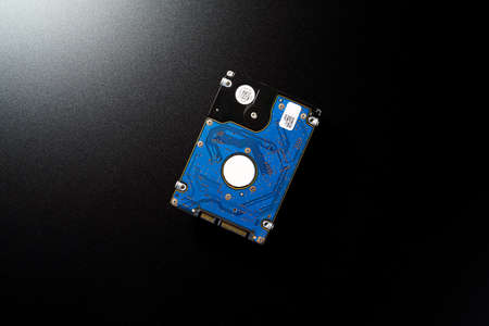 2.5 inch hard disk drive isolated on dark backgroundの写真素材