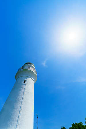 White lighthouse on a clear blue dayの写真素材