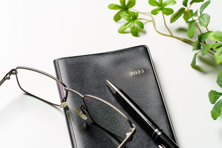 2023 Notebook and pen on white background (2023 schedule book)
