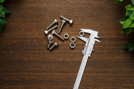 Metal vernier caliper on wooden backgroundの写真素材