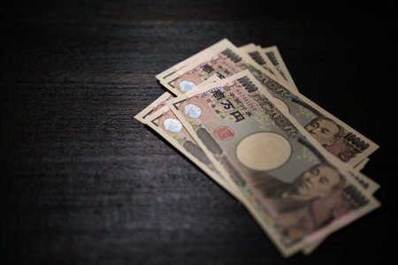 Japanese banknotes on dark backgroundの写真素材