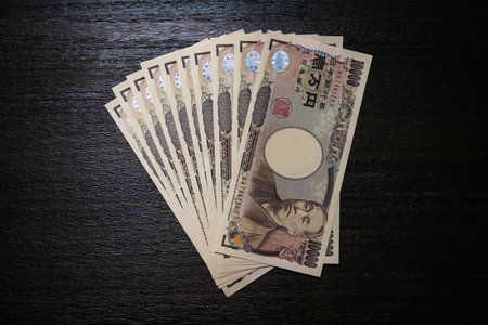 Japanese banknotes on dark backgroundの写真素材