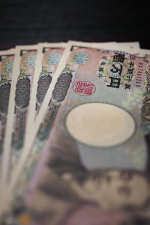 Japanese banknotes on dark backgroundの写真素材
