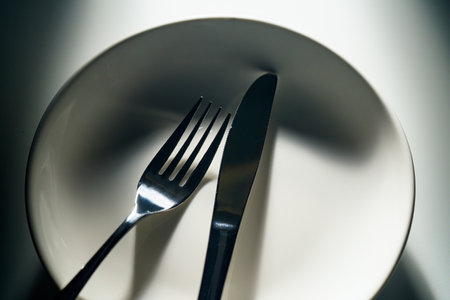 Fork and knife on dark backgroundの写真素材