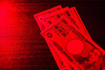 Japanese banknotes on dark backgroundの写真素材